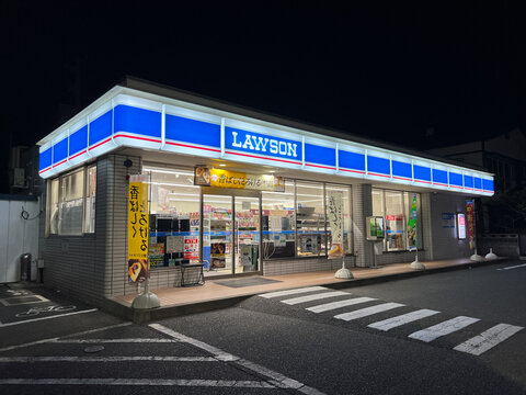Lawson convenience store illuminated at night, a typical Japanese konbini, Japan.