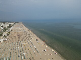 Aerial Beach View: A mesmerizing high-angle view unveils a sun-drenched beach scene, revealing an...