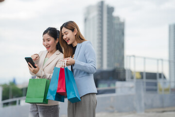 Retail Therapy Revelations: Two elegant women, immersed in the city's pulse, revel in the thrill of...