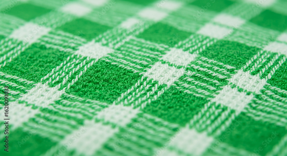 Poster A close-up view showcases a textured green and white checkered fabric, creating a visually appealing pattern with depth and detail.