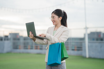 Online Shopping Delight: A fashionable individual beams with delight as they use a laptop, with...
