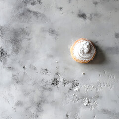 Gray textured surface contrasts with light pastry, powdered. Use it for product photography, backgrounds, social media, or food blogs.