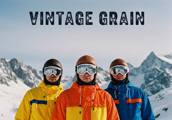 Three skiers in yellow, orange, and blue jackets stand close against a snowy mountain backdrop under bright, slightly grainy light, evoking a vintage feel.
