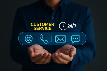Businessman presenting 24/7 customer service options with virtual icons for email, phone call, and live chat. Concept of a contact center, user support, and omnichannel communication.