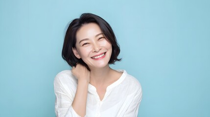 Cheerful Korean woman in her 40s smiling playfully