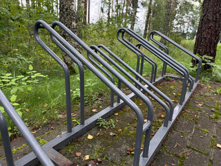 Empty Metal Bicycle Rack in a Forest Park Area on Mossy Pavement, Lithuania
