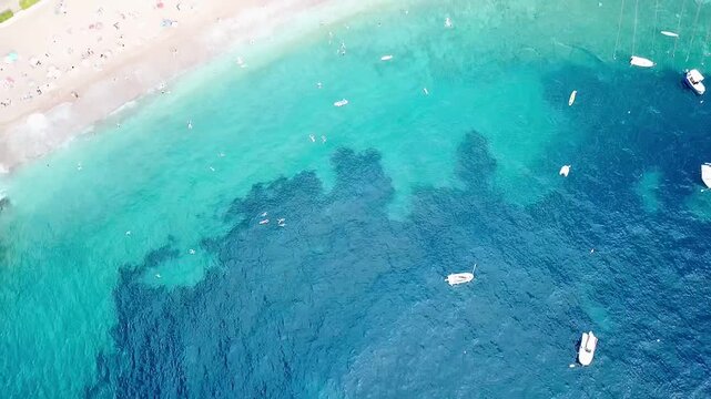 A drone video from above of the bay and the beach on the island of Sveti Stefan in Montenegro