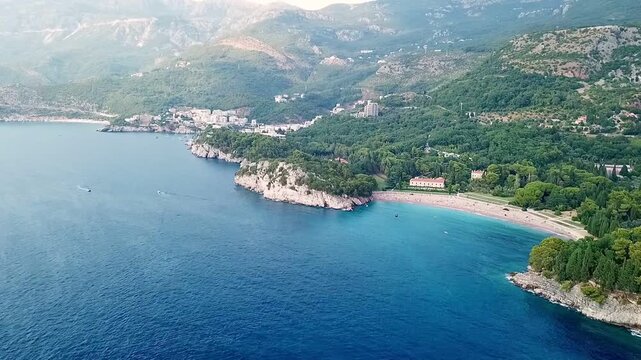 A drone video from the sea on Milocer beach and the park of Sveti Stefan in Montenegro