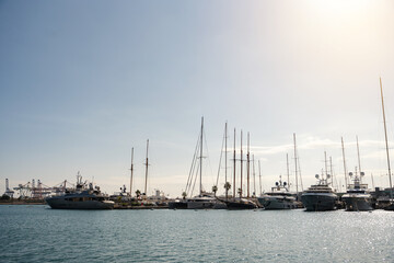 Sailing yachts anchored to a pier in the Valencia marina, Spain