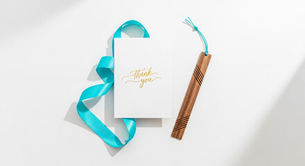 Elegant Thank You Card with Ribbon and Wooden Bookmark on Minimalist Background
