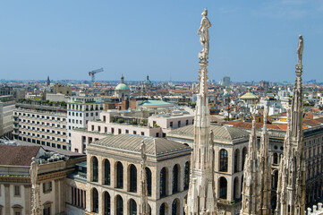 statues on the tops of the spires of the Duomo Cathedral in Milan, Italy