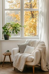 Fototapeta premium Cozy chair by the window with autumn view