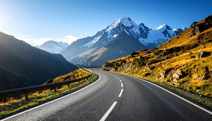 Naklejka premium Alpine Serenity: Curving Mountain Road Leading to Majestic Snow-Capped Peaks