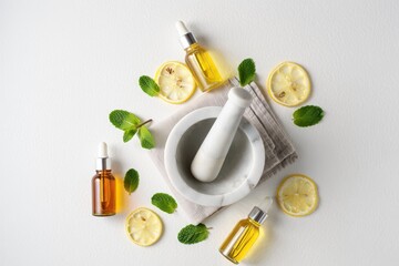 Natural skincare ingredients featuring lemon, mint, and essential oils for holistic wellness and selfcare