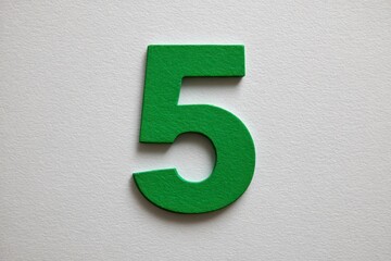 Green number five on white surface