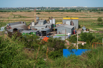 View of a large production complex. Industrial buildings outside the city