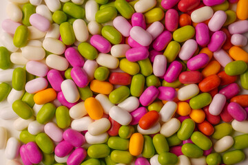 Sweet multicolored candies isolated on white background.
