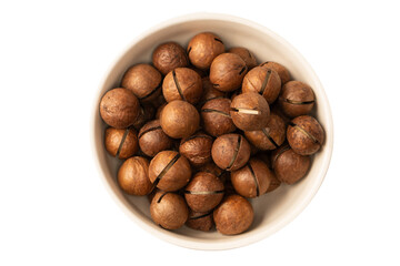 Macadamia nuts in a shell isolated on a white background.