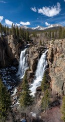 Mountain waterfall cascading,  rocky cliffs