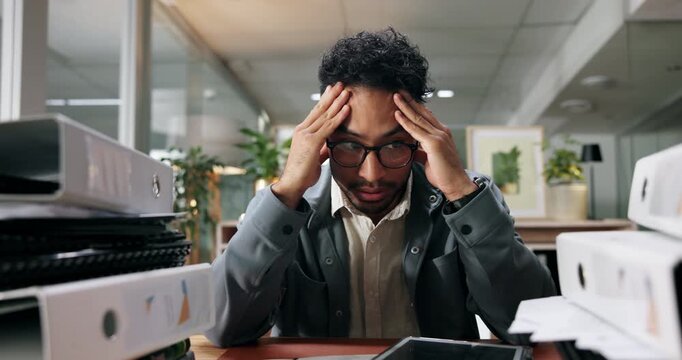 Documents, overwhelmed and business man at desk for deadline, tasks and work load. Thinking, office and person stressed out with paperwork, files and report for burnout, frustrated and overworked