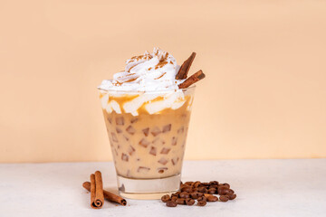 Iced cinnamon latte with whipped cream