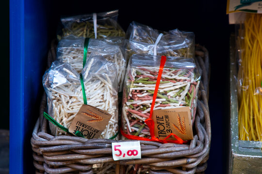 Trofie type of Italian pasta, souvenir gift from Liguria, sale food on street Italian village. Cinque Terre. Italia, Manarola - July 15, 2025.