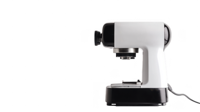 A modern countertop mixer in black and white is set on a kitchen surface, ready for various food preparation tasks