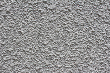 Rough surface of grey concrete wall background. Uneven cement wall texture.