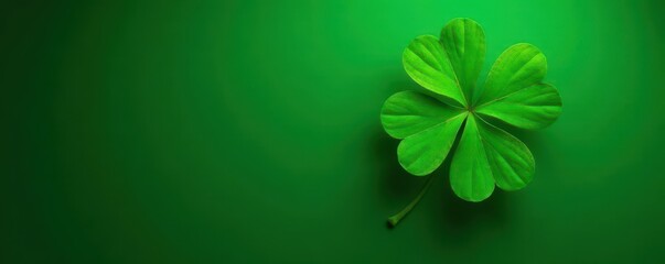 Emerald background with four-leaf clover in center, lucky symbol, good luck, earthy tones