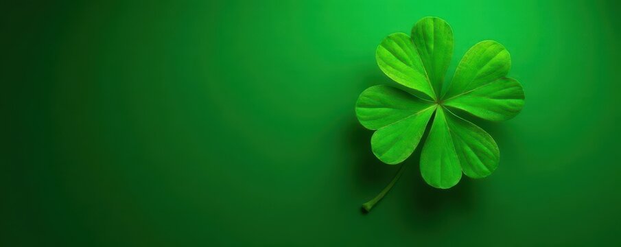 Emerald background with four-leaf clover in center, lucky symbol, good luck, earthy tones