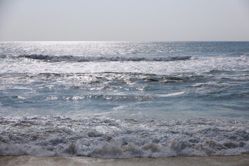Sunny day on the ocean shore. Summer seascape