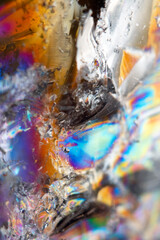 Beautiful close up of quartz crystal rock shard with reflective rainbow spiritual light
