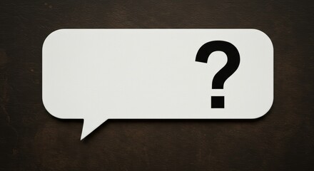 Blank chat bubble on textured background with question mark for communication concepts