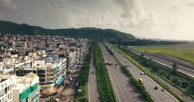 Aerial view of Navi Mumbai near Navi Mumbai International Airport, showing modern roads, scenic surroundings, and urban infrastructure. Ideal for smart city and development themes. 
