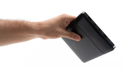 Hand gripping a tech device tightly