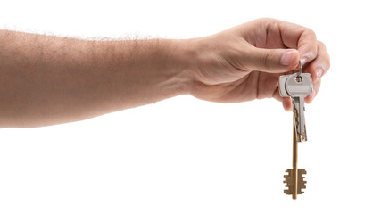 Person is holding a key in a hand outdoors