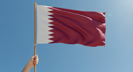 Waving Qatar Flag Against Clear Blue Sky, Symbol of National Pride and Identity
