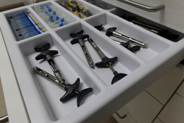 Organized Dental Tools and Syringes in Clinic Drawer