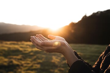 Embrace the golden hour's promise with open hands reaching towards a bright, hopeful sunrise over a serene landscape