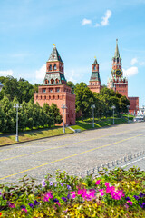 View of the Kremlin from the Bolshoy Moskvoretsky Bridge with flowers on a clear sunny day, Moscow.  Sights of Russia. Architecture of World tourism.