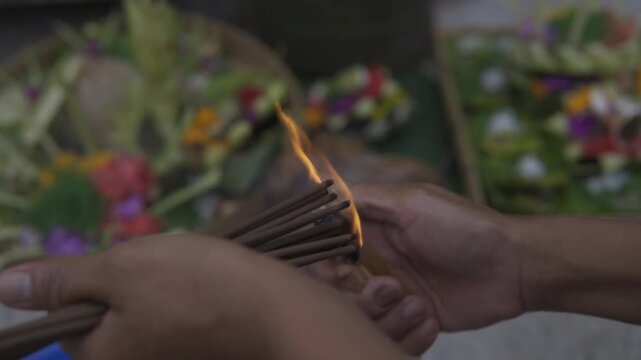 fotage of Balinese people praying with incense