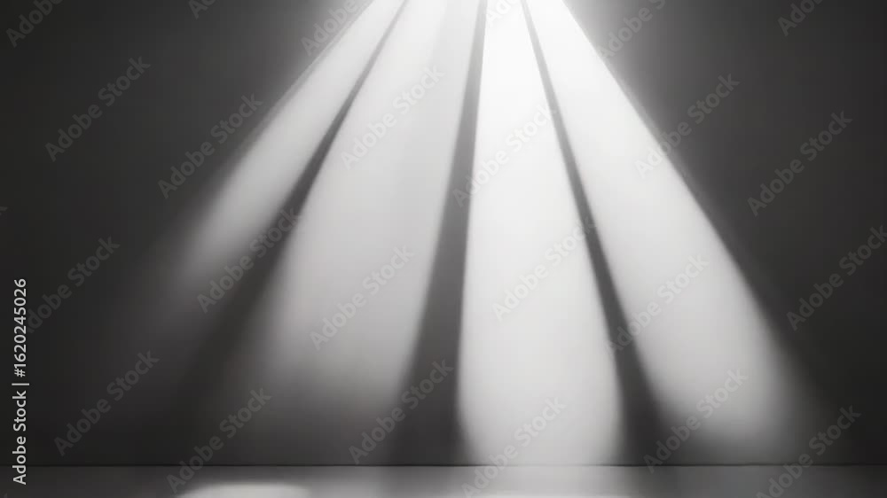 Poster light beams illuminating empty room with gray walls and floor