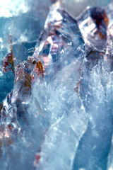 Beautiful close up of quartz crystal rock shard with reflective rainbow spiritual light