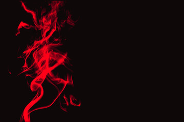 Vibrant red smoke swirling on black background