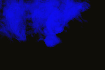 Vivid blue smoke swirls on black background