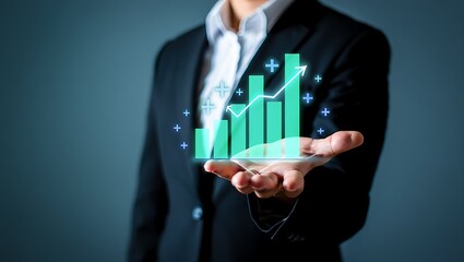Photo of a holographic growth chart hovers over a business persons open hand