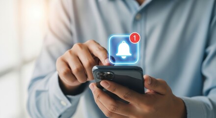 Person using smartphone receiving a notification alert with a bell icon