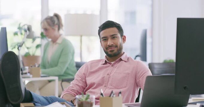Business, man and rest with computer in office with playful expression, flirt personality and flattery. Male person, wink gesture and charm colleague on work break, employee secret and feet on table