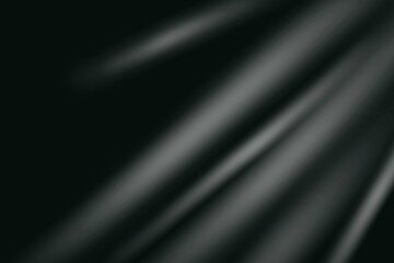 Soft white light rays on black background