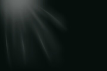 Soft white light rays on black background